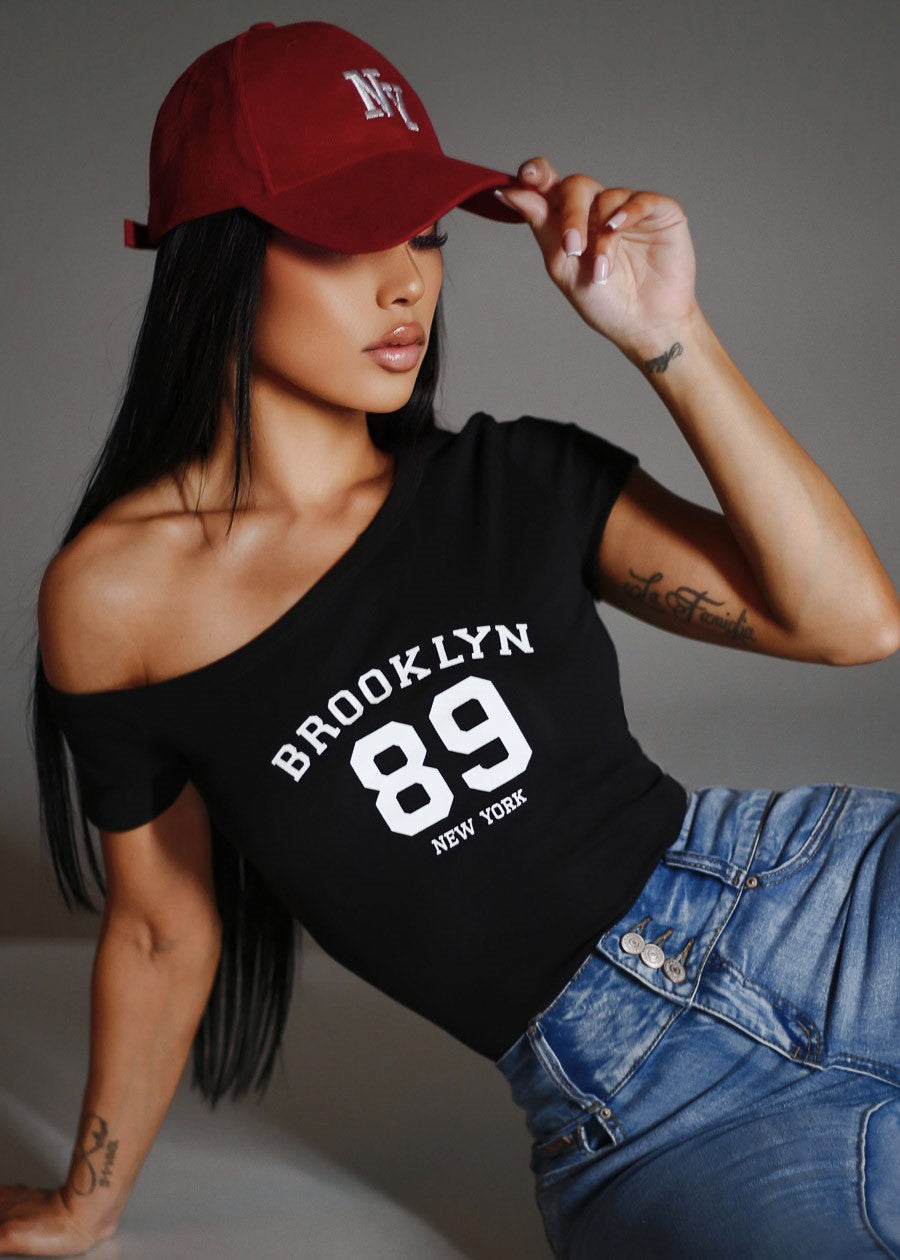 Asymmetrical Neckline Stretch Graphic Top Black 